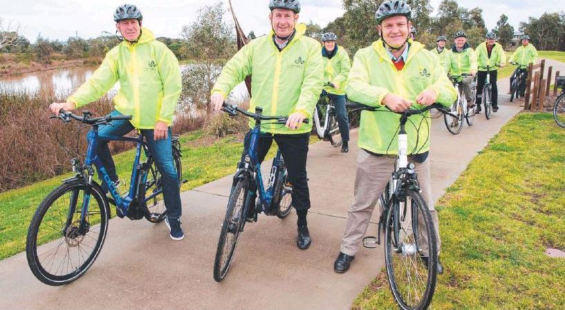 Cyclists On Path To Link Roads